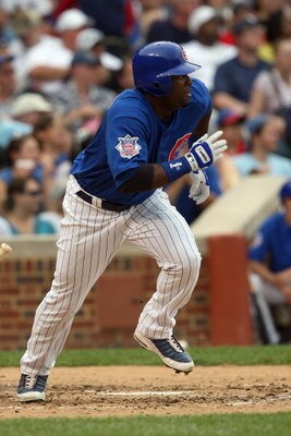 CHICAGO - JUNE 18:  Milton Bradley #21 of the Chicago Cubs runs to first against the Chicago White Sox during the game on June 18, 2009 at Wrigley Field in Chicago, Illinois. (Photo by Jonathan Daniel/Getty Images)