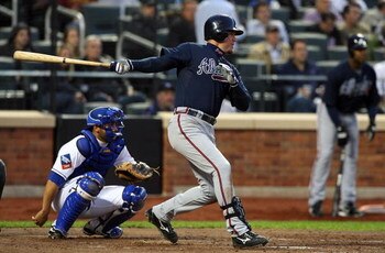 NEW YORK - MAY 12:  Chipper Jones #10 of the Atlanta Braves hits a single in the fourth inning against the New York Mets at Citi Field May 12, 2009 in the Flushing neighborhood of the Queens borough of New York City.  (Photo by Jim McIsaac/Getty Images)