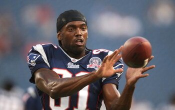 FOXBORO, MA - AUGUST 20:  Randy Moss #81 of the New England Patriots catches a pass during warm ups against the Cincinnati Bengals during their preseason game at Gillette Stadium on August 20, 2009 in Foxboro, Massachusetts.  (Photo by Jim Rogash/Getty Im