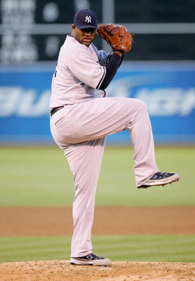 OAKLAND, CA - AUGUST 18: CC Sabathia #52 of the New York Yankees pitches against the Oakland Athletics during their game at the Oakland Coliseum on August 18, 2009 in Oakland, California. (Photo by Ezra Shaw/Getty Images)