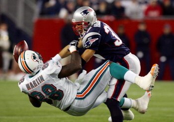FOXBORO, MA - DECEMBER 23:  Rodney Harrison #37 of the New England Patriots breaks up a pass intended for David Martin #88 of the Miami Dolphins during their game at Gillette Stadium on December 23, 2007 in Foxboro, Massachusetts.  (Photo by Jim McIsaac/G