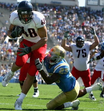 PASADENA, CA - SEPTEMBER 20:  Tight end Rob Gronkowski #48 of the Arizona Wildcats scores on a 4 yard touchdown reception past Bret Lockett #4 of the UCLA Bruins during the fourth quarter of the college football game at the Rose Bowl on September 20, 2008