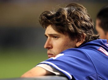 PHOENIX - JUNE 23:  Ian Kinsler #5 of the Texas Rangers looks on from the dugout during the major league baseball game against the Arizona Diamondbacks at Chase Field on June 23, 2009 in Phoenix, Arizona. The Diamondbacks defeated the Rangers 8-2.  (Photo