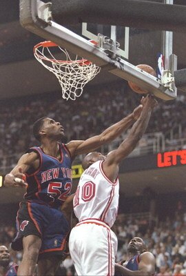 14 May 1997:  Guard Tim Hardaway of the Miami Heat and forward Buck Williams of the New York Knicks fight for the ball during a playoff game at the Miami Arena in Miami, Florida.  The Heat won the game 96-81. Mandatory Credit: Andy Lyons  /Allsport