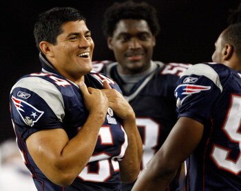 FOXBORO, MA - AUGUST 7: Tedy Bruschi #54 of the New England Patriots laughs from the sideline against the Baltimore Ravens during the preseason game at Gillette Stadium on August 7, 2008 in Foxboro, Massachusetts. (Photo by Jim Rogash/Getty Images)