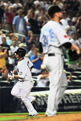 NEW YORK - AUGUST 10:  Jerry Hairston Jr. #17 of the New York Yankees rounds the bases after hitting a home run in the fourth inning against the Toronto Blue Jays during their game on August 10, 2009 at Yankee Stadium in the Bronx borough of New York City