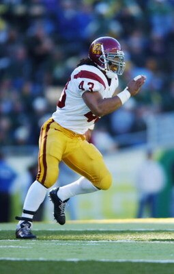 EUGENE - OCTOBER 26:  Safety Troy Polamalu #43 of the USC Trojans runs on the field during the game against the Oregon Ducks at Autzen Stadium on October 26, 2002 in Eugene, Oregon. USC defeated Oregon 44-33.  (Photo by Otto Greule Jr/Getty Images) 