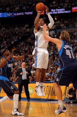 DENVER - MAY 05:  J.R. Smith #1 of the Denver Nuggets shoots over Dirk Nowitzki #41 of the Dallas Mavericks in Game Two of the Western Conference Semifinals during the 2009 NBA Playoffs at Pepsi Center on May 5, 2009 in Denver, Colorado. The Nuggets defea