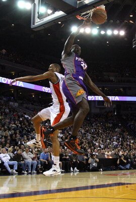 OAKLAND, CA - MARCH 15:  Jason Richardson #23 of the Phoenix Suns dunks over Anthony Randolph #4 of the Golden State Warriors during an NBA game on March 15, 2009 at Oracle Arena in Oakland, California. NOTE TO USER: User expressly acknowledges and agrees