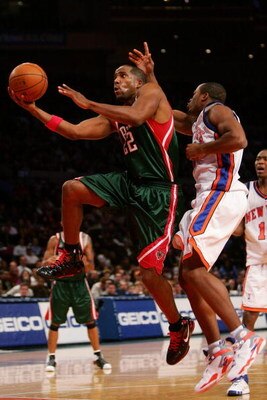 NEW YORK - NOVEMBER 30:  Michael Redd #22 of the Milwaukee Bucks drives past Fred Jones #2 of the New York Knicks on November 30, 2007 at Madison Square Garden in New York City. The Knicks won the match 91-88. NOTE TO USER: User expressly acknowledges and