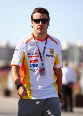 VALENCIA, SPAIN - AUGUST 22:  Fernando Alonso of Spain and Renault walks in the paddock following qualifying for the European Formula One Grand Prix at the Valencia Street Circuit on August 22, 2009, in Valencia, Spain.  (Photo by Ryan Pierse/Getty Images