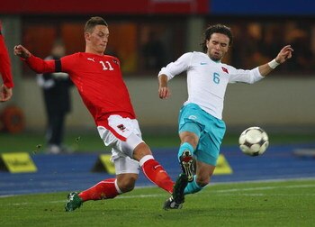 VIENNA, AUSTRIA - NOVEMBER 19:  Marko Arnautovic  (L) of Austria competes for the ball against Gokhan Gonul (R) of Turkey during the International Friendly match between Austria and Turkey at Ernst Happel Stadion on November 19, 2008 in Vienna, Austria.  