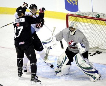 CALGARY, CANADA - AUGUST 24: Defenceman Chris Pronger keeps another player away from goaltender Roberto Luongo during the first practice of the Team Canada Olympic Orientation Camp on August 24, 2009 at the Pengrowth Saddledome in Calgary, Alberta, Canada