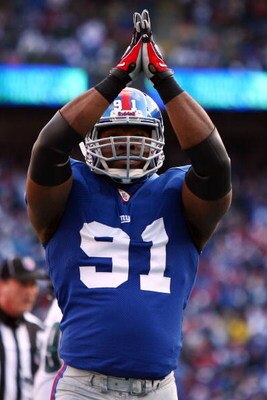 EAST RUTHERFORD, NJ - JANUARY 11:  Justin Tuck #91 of the New York Giants reacts after a saftey against the Philadelphia Eagles during the NFC Divisional Playoff Game on January 11, 2009 at Giants Stadium in East Rutherford, New Jersey.  (Photo by Al Bell