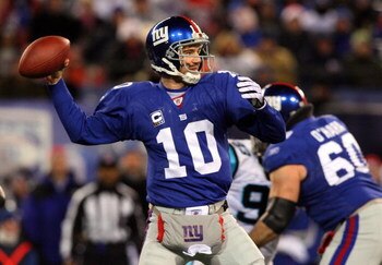 EAST RUTHERFORD, NJ - DECEMBER 21:  Eli Manning #10 of the New York Giants throws a pass against the Carolina Panthers on December 21, 2008 at Giants Stadium in East Rutherford, New Jersey.  (Photo by Jim McIsaac/Getty Images)