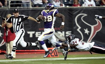 HOUSTON - AUGUST 31:  Running back Adrian Peterson #28 scores on a 75 yard run as strong safety Dominique Barber #34 of the Houston Texans makes a diving attempt to make the tackle at Reliant Stadium on August 31, 2009 in Houston, Texas.  (Photo by Bob Le