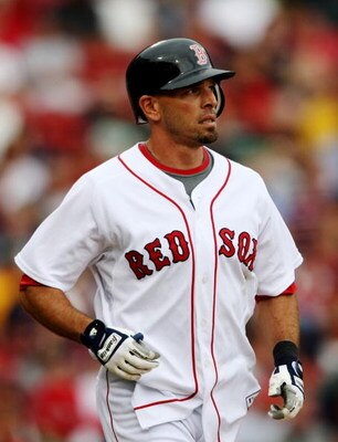 BOSTON - AUGUST 13:  Chris Woodward #3 of the Boston Red Sox moves to first after being hit with the pitch during the game against the Detroit Tigers at Fenway Park on August 13, 2009 in Boston, Massachusetts. (Photo by Elsa/Getty Images)