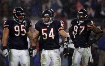 CHICAGO - JANUARY 21:  (L-R) Ian Scott, Brian Urlacher #54 and Mark Anderson #97 of of the Chicago Bears are seen on the field against the New Orleans Saints during the NFC Championship Game January 21, 2007 at Soldier Field in Chicago, Illinois.  (Photo 