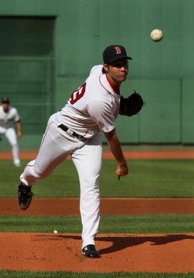 BOSTON - AUGUST 22:  Junichi Tazawa #63 of the Boston Red Sox delivers a pitch during the game against the New York Yankees at Fenway Park on August 22, 2009 in Boston, Massachusetts. (Photo by Jim Rogash/Getty Images)