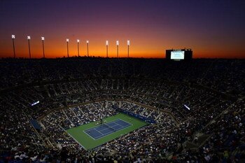 NEW YORK - SEPTEMBER 01: The sunsets over Arthur Ashe Stadium as Maria Sharapova of Russia takes on Tsvetana Pironkova of Bulgaria during day two of the 2009 U.S. Open at the USTA Billie Jean King National Tennis Center on September 1, 2009 in Flushing ne