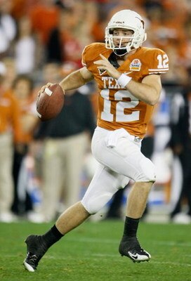 GLENDALE, AZ - JANUARY 05:  Quarterback Colt McCoy #12 of the Texas Longhorns scrambles with the ball against the Ohio State Buckeyes during the Tostitos Fiesta Bowl Game on January 5, 2009 at University of Phoenix Stadium in Glendale, Arizona.  (Photo by