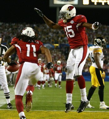TAMPA, FL - FEBRUARY 01:  Larry Fitzgerald #11 of the Arizona Cardinals celebrates his touchdown catch against the Pittsburgh Steelers with Steve Breaston #15 in the fourth quarter during Super Bowl XLIII on February 1, 2009 at Raymond James Stadium in Ta