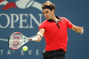 NEW YORK - AUGUST 31:  Roger Federer of Switzerland returns a shot against Devin Britton of the United States during day one of the 2009 U.S. Open at the USTA Billie Jean King National Tennis Center on August 31, 2009 in Flushing neighborhood of the Queen