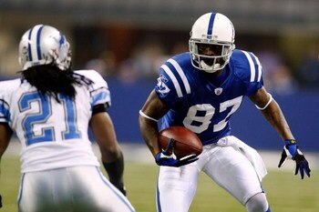 INDIANAPOLIS - DECEMBER 14:  Reggie Wayne #87 of the Indianapolis Colts looks to get past Travis Fisher #21 of the Detroit Lions on December 14, 2008 at Lucas Oil Stadium in Indianapolis, Indiana.  (Photo by Chris Graythen/Getty Images)