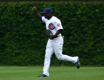 CHICAGO - AUGUST 28: Right fielder Milton Bradley #21 of the Chicago Cubs celebrates after their 5-2 win over the New York Mets at Wrigley Field on August 28, 2009 in Chicago, Illinois. (Photo by Jonathan Daniel/Getty Images)
