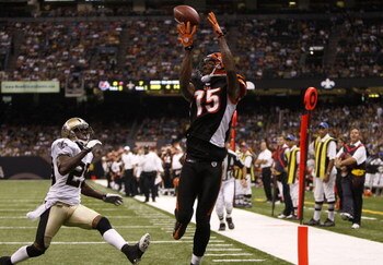 NEW ORLEANS - AUGUST 14:  Wide receiver Chris Henry #15 of the Cincinnati Bengals catches the ball in the end zone for a touchdown against Jason David #29 of the New Orleans Saints during the preseason game on August 14, 2009 at the Superdome in New Orlea
