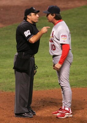HOUSTON - OCTOBER 16:  Manager Tony La Russa #10 of the St. Louis Cardinals argues with home plate umpire Phil Cuzzi after being thrown out of Game Four of the National League Championship Series against the Houston Astros at Minute Maid Park on October 1