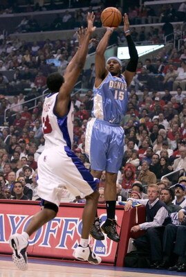 LOS ANGELES, CA - MAY 01:  Carmelo Anthony #15 of the Denver Nuggets shoots over Quinton Ross #13 of the Los Angeles Clippers in game five of the Western Conference Quarterfinals during the 2006 NBA Playoffs on May 1, 2006 at Staples Center in Los Angeles