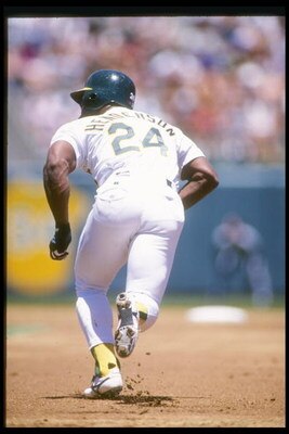 26 Jun 1994:  Outfielder Rickey Henderson of the Oakland Athletics steals second base during a game against the Detroit Tigers at the Oakland Coliseum in Oakland, California. Mandatory Credit: Otto Greule  /Allsport