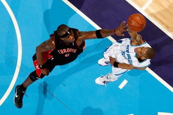 NEW ORLEANS - FEBRUARY 06:  Antonio Daniels #50 of the New Orleans Hornets makes a shot over Jermaine O'Neal #6 of the Toronto Raptors on February 6, 2009 in New Orleans, Louisiana.  NOTE TO USER: User expressly acknowledges and agrees that, by downloadin