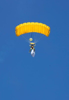 SAN FRANCISCO - AUGUST 05:  Synchronized Skydivers land at Justin Herman Plaza to celebrate the launch of the T-Mobile myTouch 3G phone with Google on August 5, 2009 in San Francisco, California.  (Photo by Michael Buckner/Getty Images for T-Mobile)