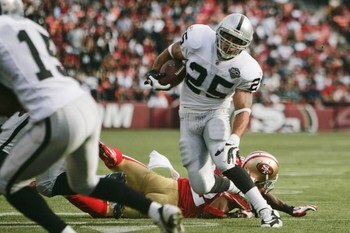 SAN FRANCISCO - AUGUST 22:  Oakland Raiders running back Justin Fargas #25 breaks a tackle during the 1st quarter as the San Francisco 49ers host the Oakland Raiders at Candlestick Park August 22, 2009 in San Francisco, California.  (Photo by David Paul M