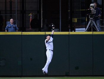 SEATTLE - AUGUST 25:  Left fielder Michael Saunders #55 of the Seattle Mariners makes a leaping catch in the second inning against the Oakland Athletics on August 25, 2009 at Safeco Field in Seattle, Washington. (Photo by Otto Greule Jr/Getty Images)