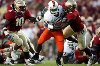 TALLAHASSEE, FL - OCTOBER 20:  Running back Javarris James of the University of Miami Hurricanes runs the ball against the Florida State Seminoles with teammates at Bobby Bowden Field at Doak Campbell Stadium October 20, 2007 in Tallahassee, Florida. Miam