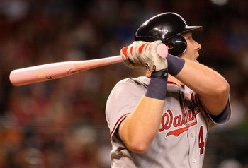 PHOENIX - MAY 10:  Adam Dunn #44 of the Washington Nationals hits a solo home run against the Arizona Diamondbacks during the third inning of the major league baseball game at Chase Field on May 10, 2009 in Phoenix, Arizona.  (Photo by Christian Petersen/
