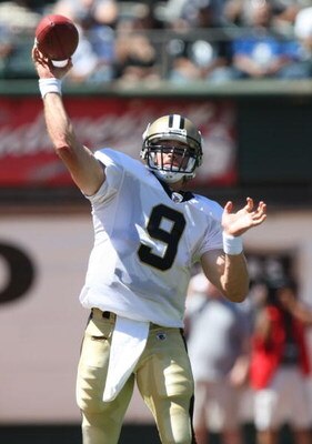 OAKLAND, CA - AUGUST 29: Quarterback Drew Brees #9 of the New Orleans Saints delivers a pass during the preseason game against the Oakland Raiders at Oakland-Alameda County Coliseum on August 29, 2009 in Oakland, California. (Photo by Jed Jacobsohn/Getty 