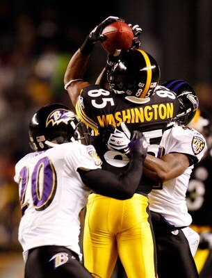 PITTSBURGH - JANUARY 18:  Wide receiver Nate Washington #85 of the Pittsburgh Steelers attempts to catch a pass against safety Ed Reed #20 and cornerback Frank Walker #41 of the Baltimore Ravens during the AFC championship game on January 18, 2009 at Hein
