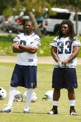 SAN DIEGO - MAY 03: Running backs LaDainian Tomlinson #21 and Gartrell Johnson #33 of the San Diego Chargers watch practice during minicamp at the Chargers training facility on May 3, 2009 in San Diego, California. (Photo by Kevin Terrell/Getty Images)