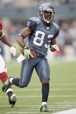 SEATTLE - NOVEMBER 16:  Deion Branch #83 of the Seattle Seahawks reacts as he runs the ball during the game against the Arizona Cardinals on November 16, 2008 at Qwest Field in Seattle, Washington. (Photo by Otto Greule Jr/Getty Images)