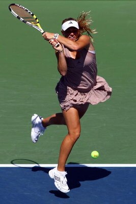 NEW YORK - SEPTEMBER 01:  Caroline Wozniacki of Denmark returns a shot against Galina Voskoboeva of Kazakhstan during day two of the 2009 U.S. Open at the USTA Billie Jean King National Tennis Center on September 1, 2009 in Flushing neighborhood of the Qu