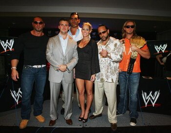 SYDNEY, AUSTRALIA - JUNE 15:  (L-R) WWE World Heavyweight Champion Batista, WWE Executive Vice President Shane McMahon, and WWE wrestlers The Great Khali, Michelle McCool, MVP and Edge pose during the WWE Smackdown Photo Call at the Sheraton on the Park H