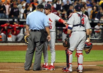 NEW YORK - JUNE 22:  Manager Tony LaRussa #10 of the St. Louis Cardinals argues a call with homeplate umpire Dale Scott as Yadier Molina looks on during the eighth inning against the New York Mets on June 22, 2009 at Citi Field in the Flushing neighborhoo