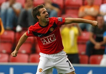 WIGAN, ENGLAND - AUGUST 22:  Michael Owen of Manchester United celebrates after scoring the 4:0 goal during the Barclays Premier League match between Wigan Athletic and Manchester United at the DW Stadium on August 22, 2009 in Wigan, England.  (Photo by A