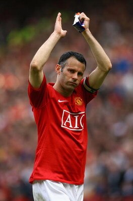 MANCHESTER, ENGLAND - MAY 16:  Ryan Giggs of Manchester United applauds the fans after his side clinched the Premier League title at the end of the Barclays Premier League match between Manchester United and Arsenal at Old Trafford on May 16, 2009 in Manc
