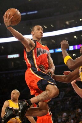 LOS ANGELES, CA - MARCH 19:  Monta Ellis #8 of the Golden State Warriors goes up with the ball against Lamar Odom #7 of the Los Angeles Lakers on March 19, 2009 at Staples Center in Los Angeles, California.  The Lakers won 114-106.  NOTE TO USER: User exp
