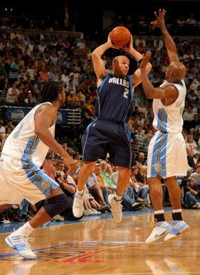 DENVER - MAY 13:  Jason Kidd #2 of the Dallas Mavericks tries to pass while under pressure from Chauncey Billups #7 and Nene #31 of the Denver Nuggets in Game Five of the Western Conference Semifinals during the 2009 NBA Playoffs at Pepsi Center on May 13